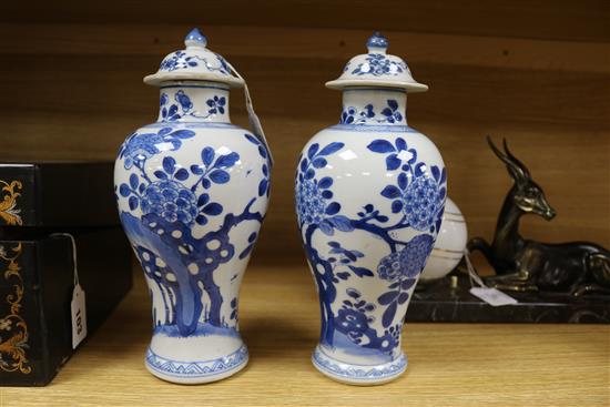 A pair of Chinese blue and white vases and covers, kangxi period Height 26cm